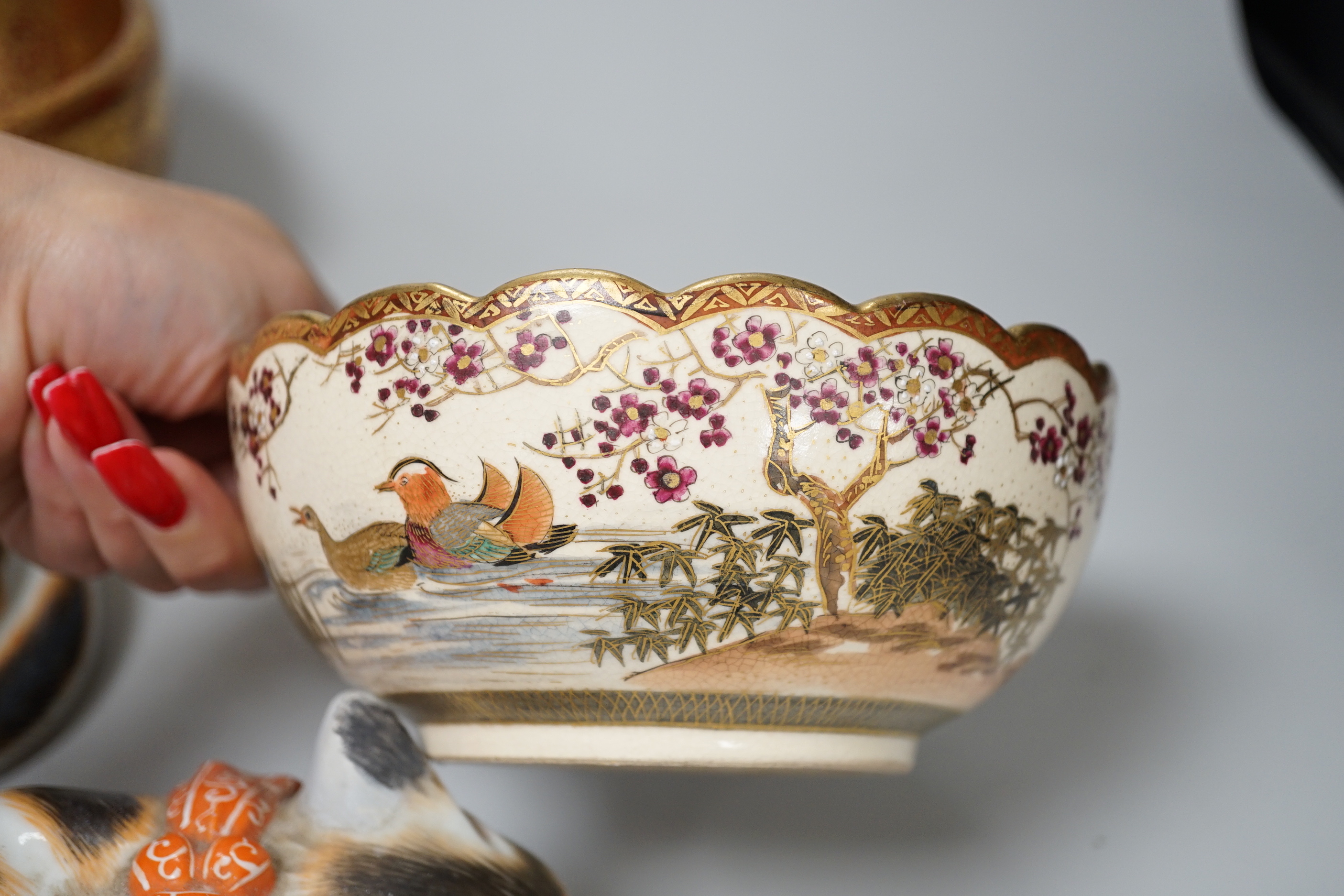 Japanese ceramics comprising pair of cats, satsuma bowl and a gilded example, the largest 17cm wide